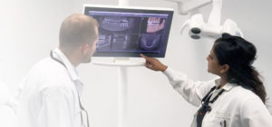 dentist reviewing dental x-rays